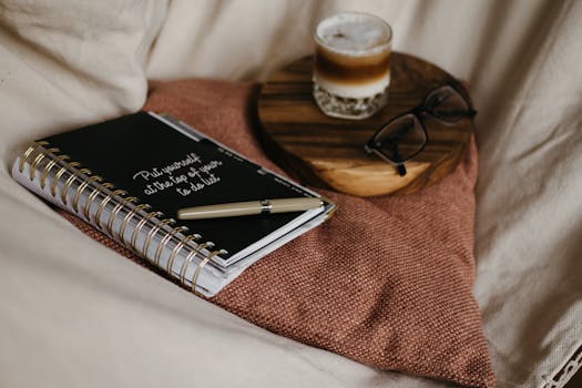 A serene workspace with a notebook and coffee