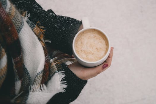 A person reviewing their checklist with a cup of coffee