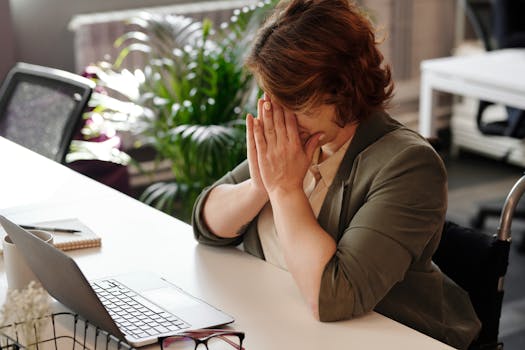 A person taking a focused break during work