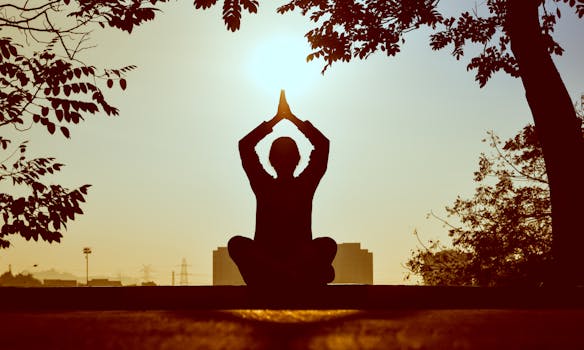 image of a person meditating outdoors