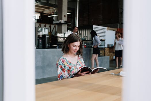 person enjoying a break with a book in a cozy corner